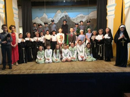 The whole cast pictured onstage.