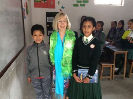 Two of the excellent readers pictured with Mrs Maguire.