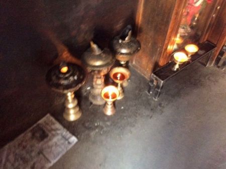 Candles lit inside the temple.