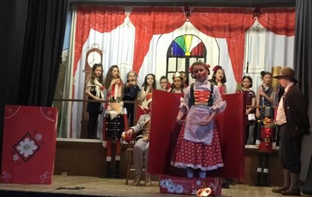 The Toymaker brings his singing ‘dolls' to the Baron's party.